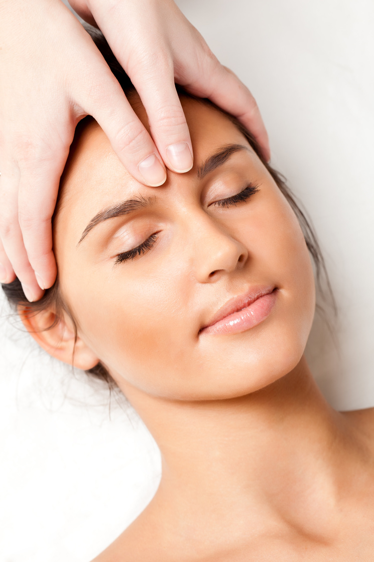 woman receiving face massage